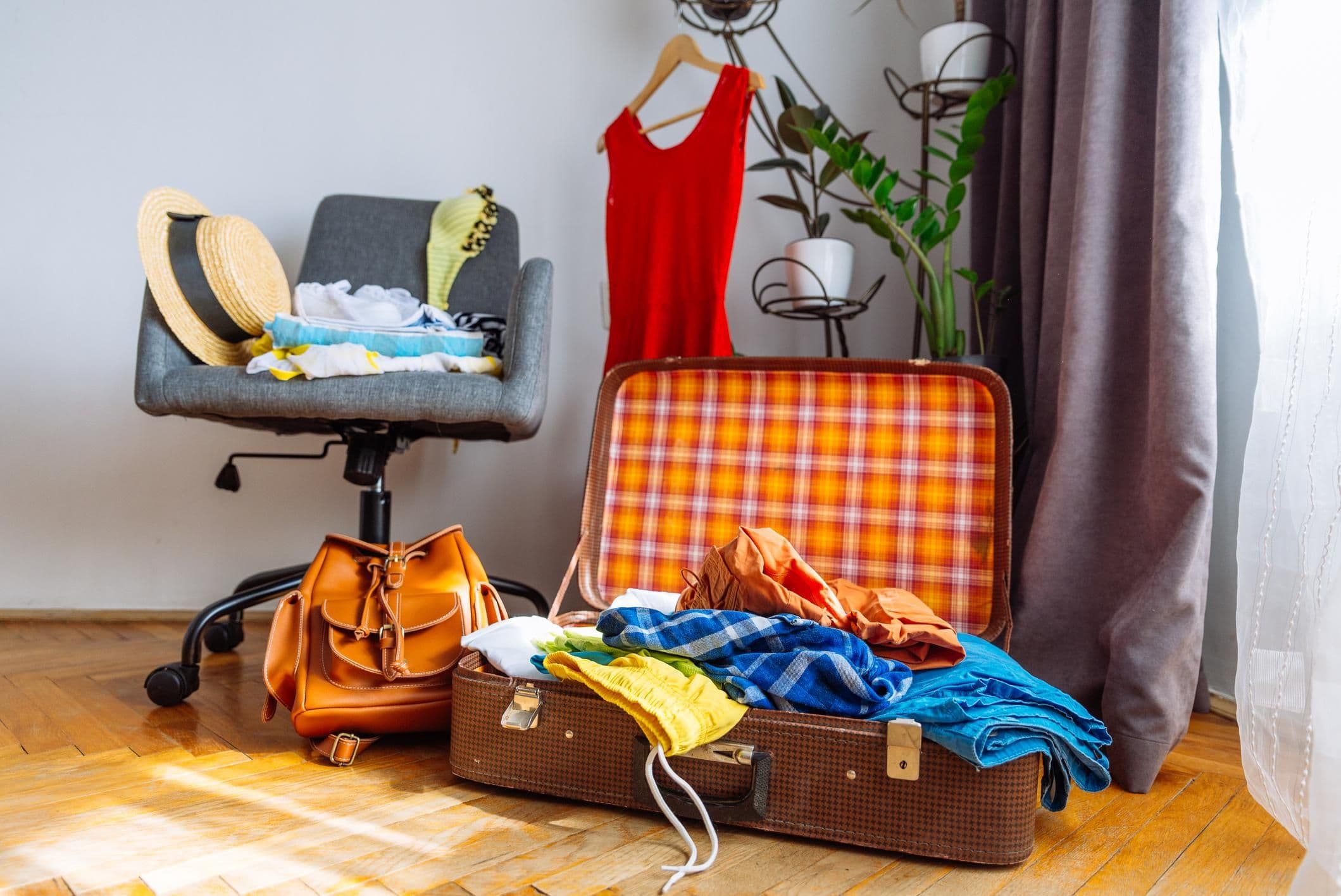 Cluttered NYC apartment with bags, clothing, and belongings taking up valuable living space